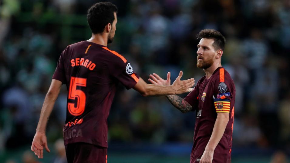 Sergio Busquets and Lionel Messi of Barcelona 
